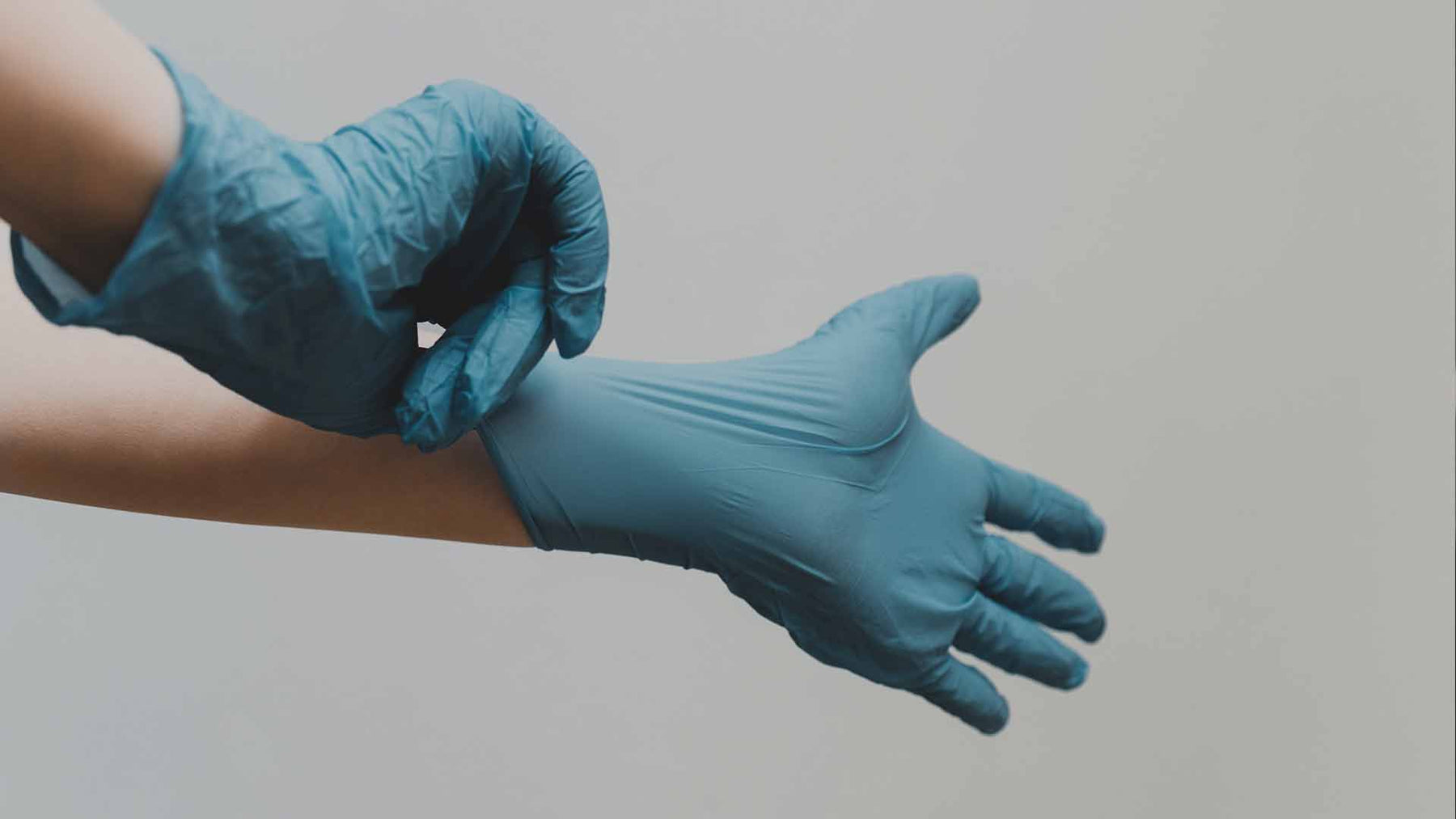 Person wearing nitrile gloves
