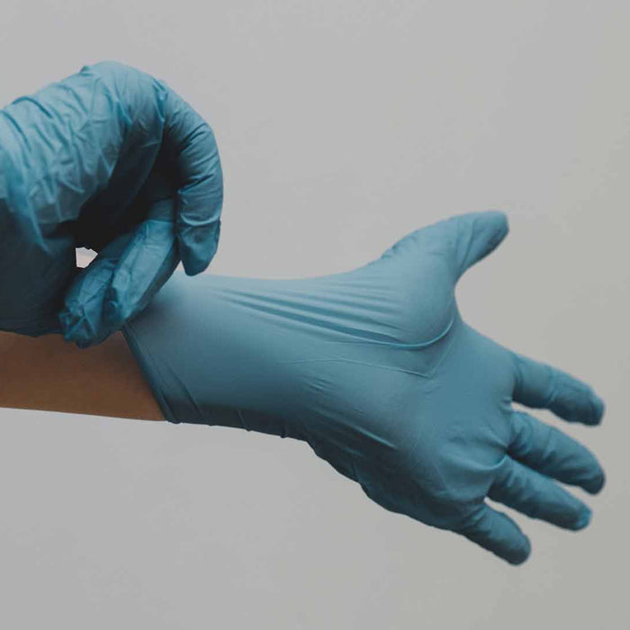 Person wearing nitrile gloves